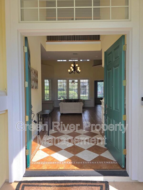 Spacious 5BR/5BA Home with Screened Pool & Pond View in Eagle Harbor at Black Creek! property image