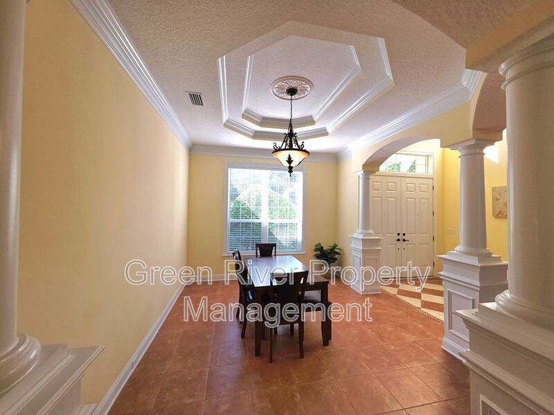Spacious 5BR/5BA Home with Screened Pool & Pond View in Eagle Harbor at Black Creek! property image