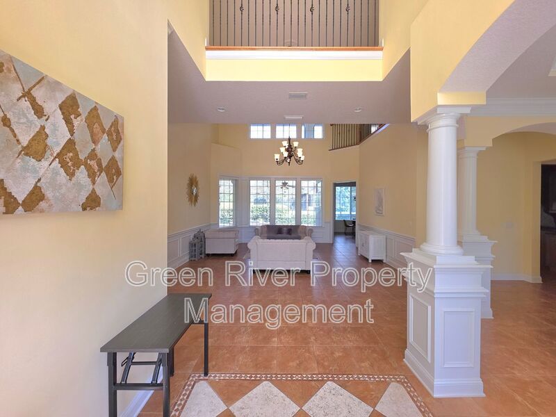 Spacious 5BR/5BA Home with Screened Pool & Pond View in Eagle Harbor at Black Creek! property image