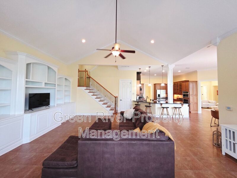Spacious 5BR/5BA Home with Screened Pool & Pond View in Eagle Harbor at Black Creek! property image