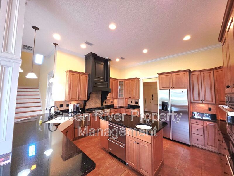 Spacious 5BR/5BA Home with Screened Pool & Pond View in Eagle Harbor at Black Creek! property image
