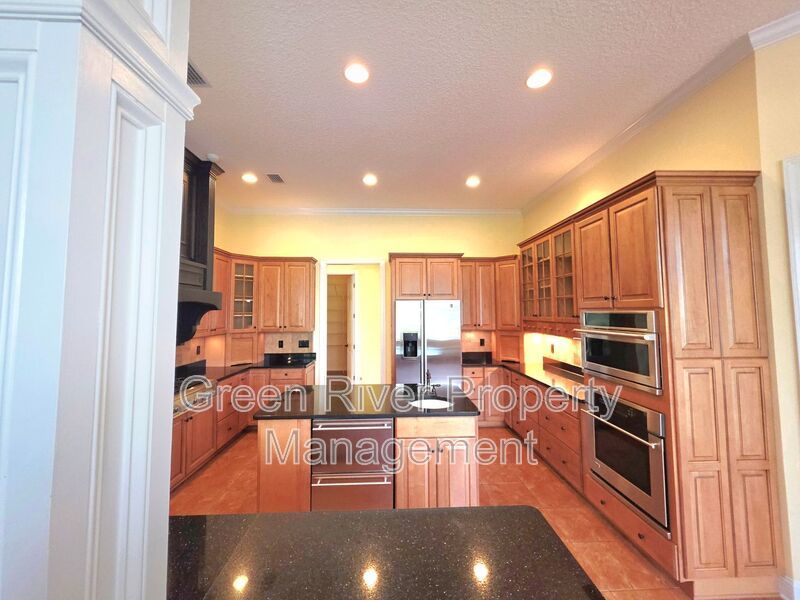 Spacious 5BR/5BA Home with Screened Pool & Pond View in Eagle Harbor at Black Creek! property image