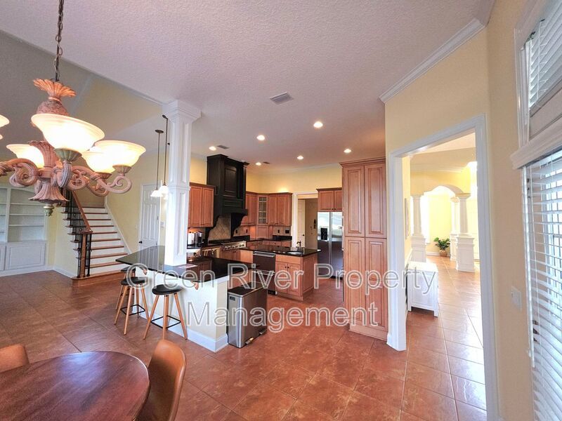 Spacious 5BR/5BA Home with Screened Pool & Pond View in Eagle Harbor at Black Creek! property image