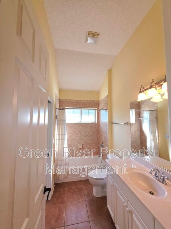 Spacious 5BR/5BA Home with Screened Pool & Pond View in Eagle Harbor at Black Creek! property image