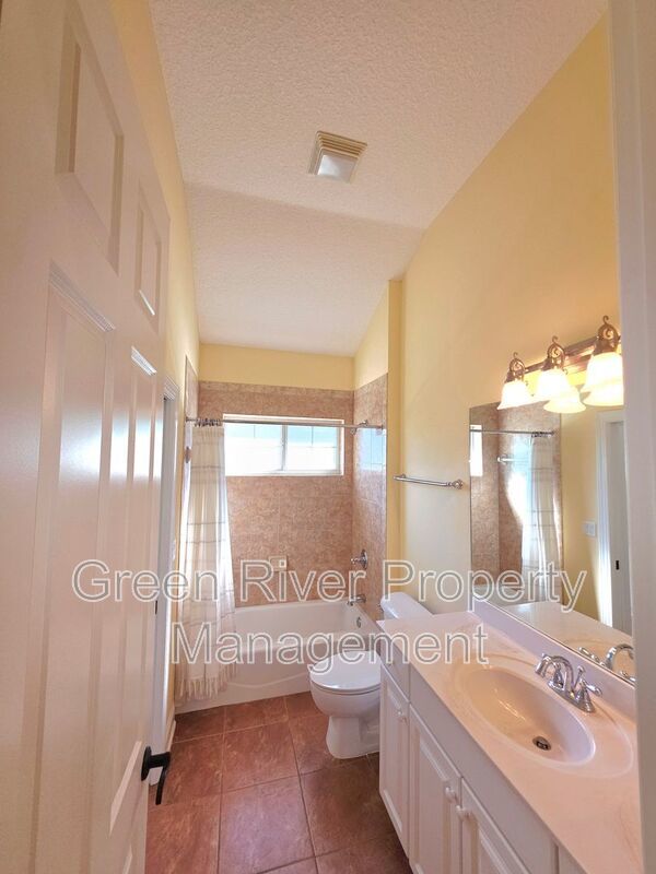 Spacious 5BR/5BA Home with Screened Pool & Pond View in Eagle Harbor at Black Creek! property image