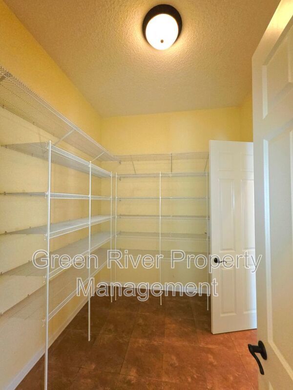 Spacious 5BR/5BA Home with Screened Pool & Pond View in Eagle Harbor at Black Creek! property image