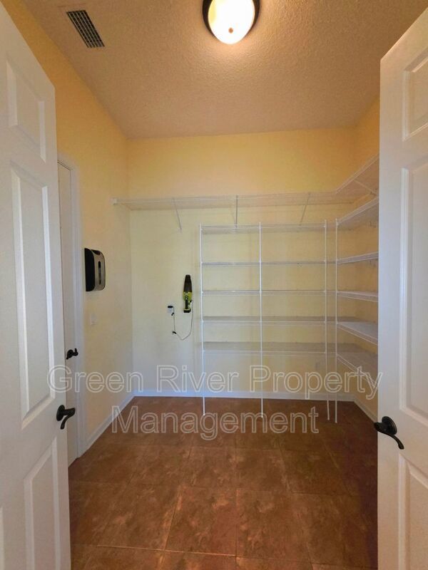 Spacious 5BR/5BA Home with Screened Pool & Pond View in Eagle Harbor at Black Creek! property image