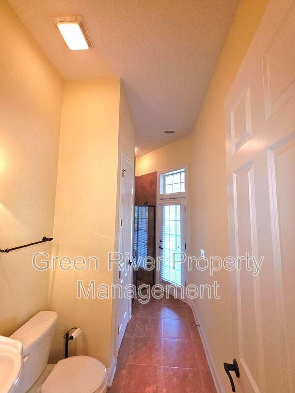 Spacious 5BR/5BA Home with Screened Pool & Pond View in Eagle Harbor at Black Creek! property image