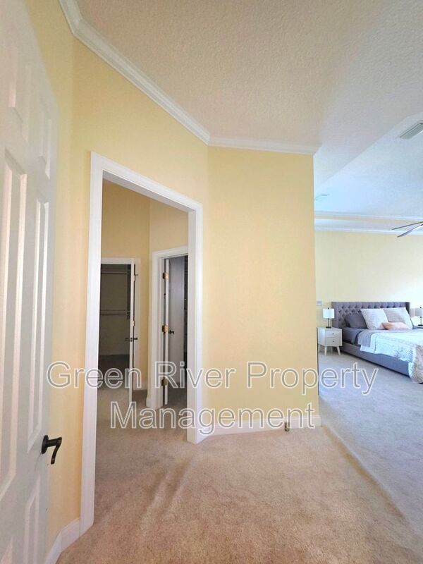 Spacious 5BR/5BA Home with Screened Pool & Pond View in Eagle Harbor at Black Creek! property image