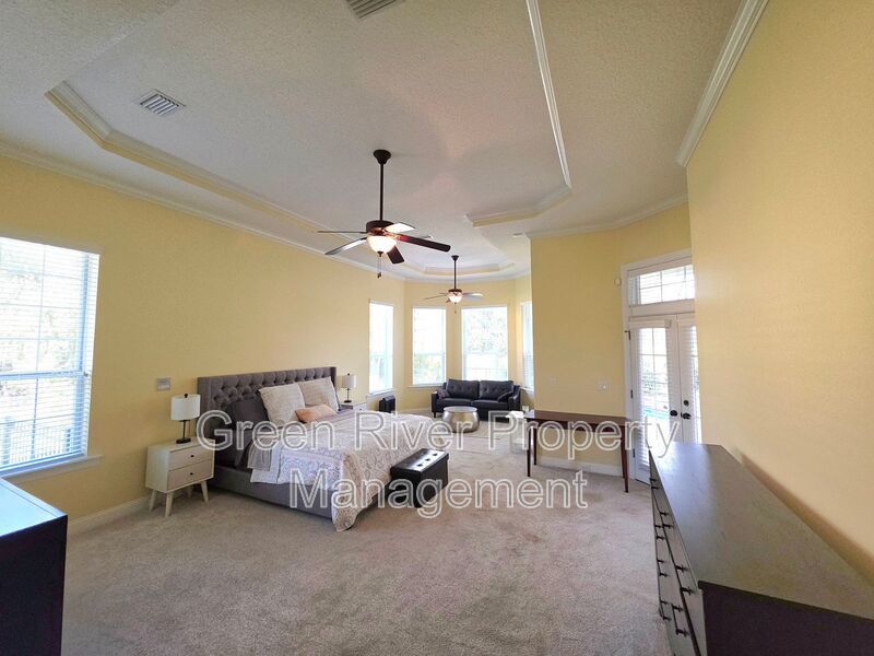 Spacious 5BR/5BA Home with Screened Pool & Pond View in Eagle Harbor at Black Creek! property image