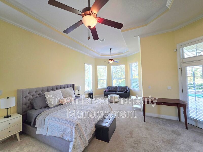 Spacious 5BR/5BA Home with Screened Pool & Pond View in Eagle Harbor at Black Creek! property image
