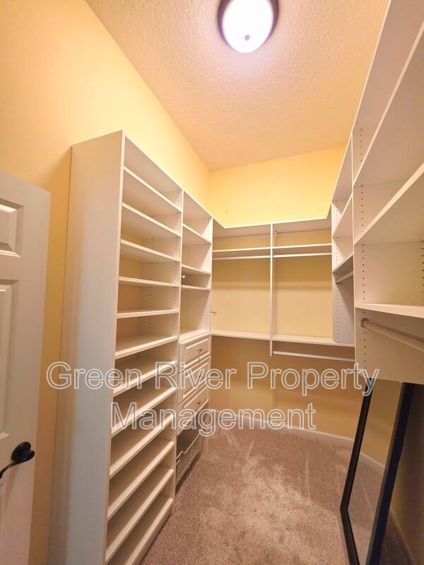Spacious 5BR/5BA Home with Screened Pool & Pond View in Eagle Harbor at Black Creek! property image