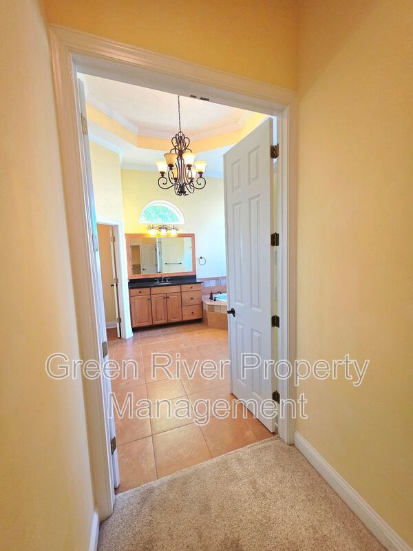 Spacious 5BR/5BA Home with Screened Pool & Pond View in Eagle Harbor at Black Creek! property image