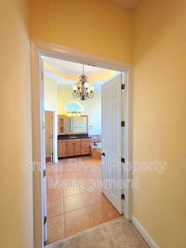Spacious 5BR/5BA Home with Screened Pool & Pond View in Eagle Harbor at Black Creek! property image