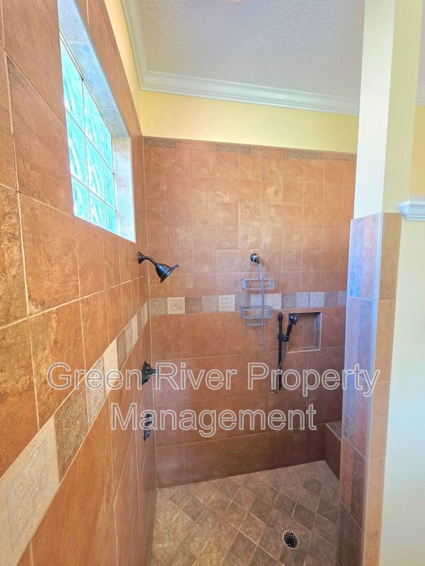Spacious 5BR/5BA Home with Screened Pool & Pond View in Eagle Harbor at Black Creek! property image