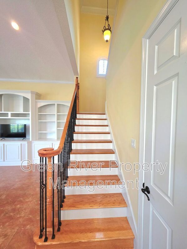 Spacious 5BR/5BA Home with Screened Pool & Pond View in Eagle Harbor at Black Creek! property image