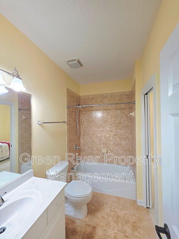 Spacious 5BR/5BA Home with Screened Pool & Pond View in Eagle Harbor at Black Creek! property image