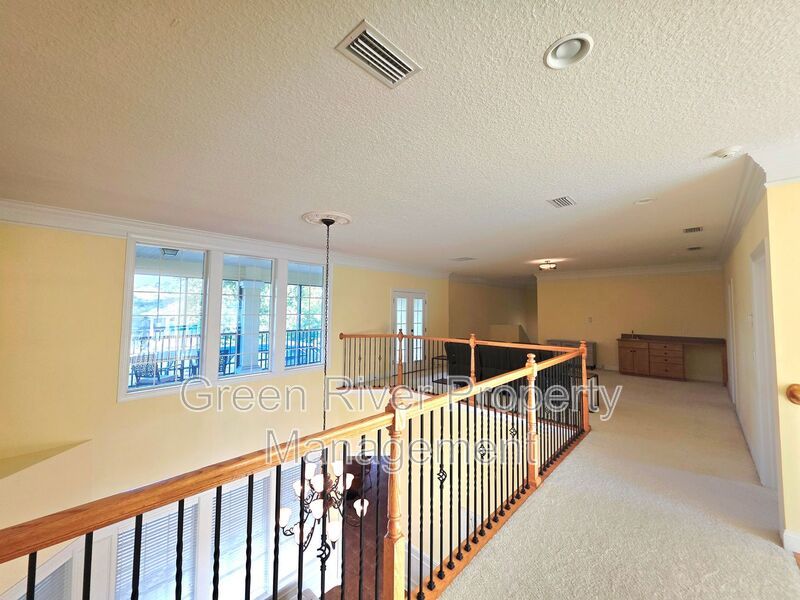 Spacious 5BR/5BA Home with Screened Pool & Pond View in Eagle Harbor at Black Creek! property image