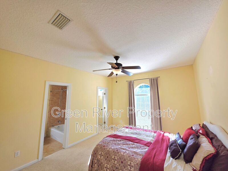 Spacious 5BR/5BA Home with Screened Pool & Pond View in Eagle Harbor at Black Creek! property image