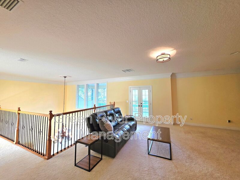 Spacious 5BR/5BA Home with Screened Pool & Pond View in Eagle Harbor at Black Creek! property image