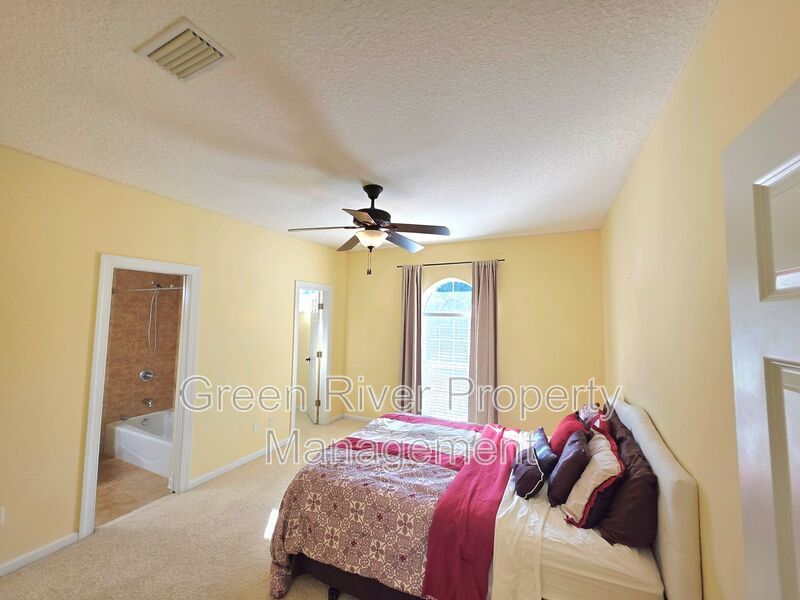 Spacious 5BR/5BA Home with Screened Pool & Pond View in Eagle Harbor at Black Creek! property image