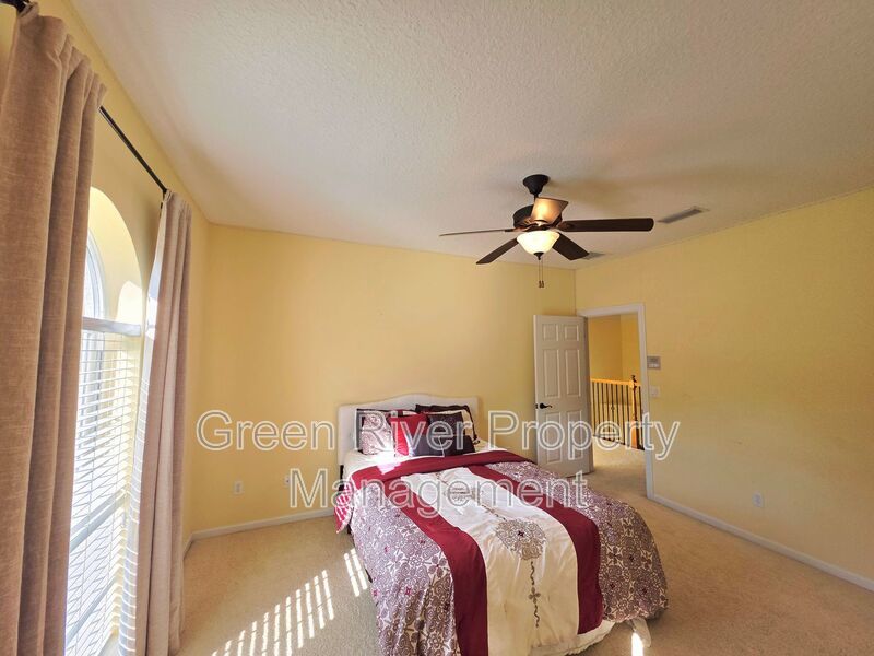 Spacious 5BR/5BA Home with Screened Pool & Pond View in Eagle Harbor at Black Creek! property image