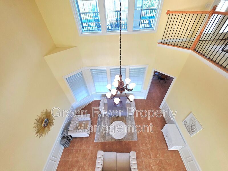 Spacious 5BR/5BA Home with Screened Pool & Pond View in Eagle Harbor at Black Creek! property image