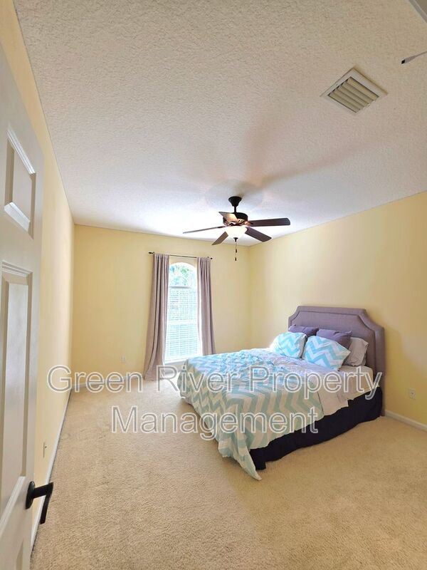 Spacious 5BR/5BA Home with Screened Pool & Pond View in Eagle Harbor at Black Creek! property image