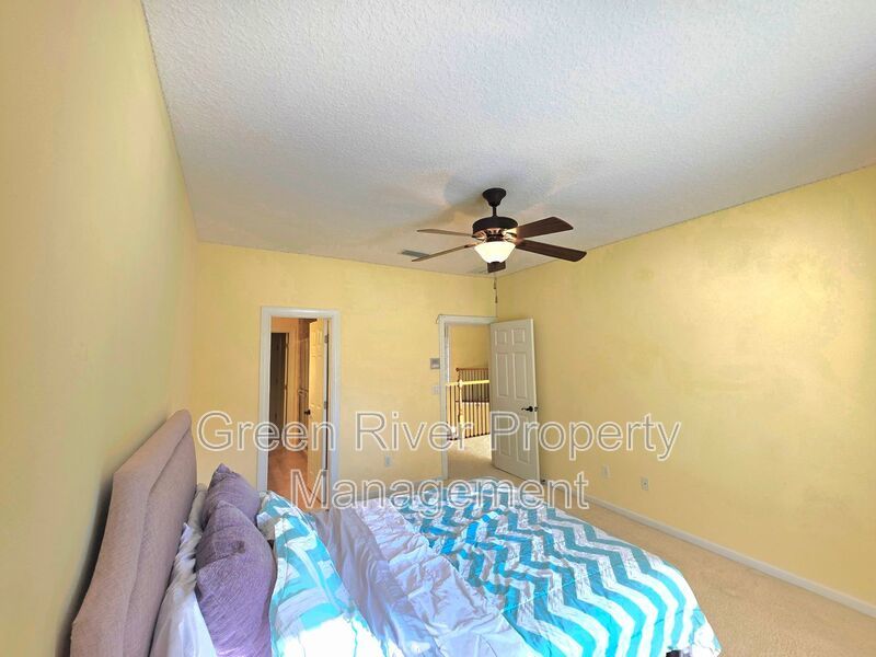 Spacious 5BR/5BA Home with Screened Pool & Pond View in Eagle Harbor at Black Creek! property image