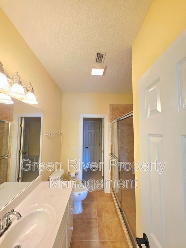 Spacious 5BR/5BA Home with Screened Pool & Pond View in Eagle Harbor at Black Creek! property image
