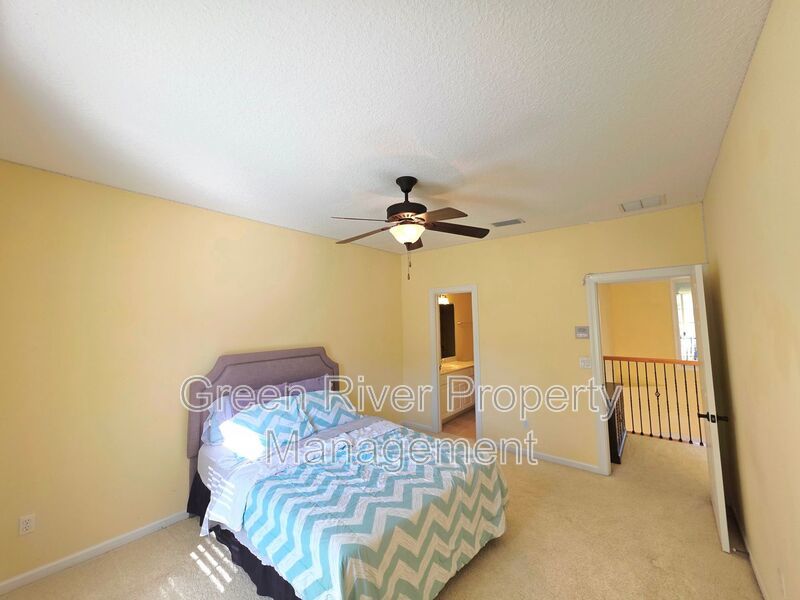 Spacious 5BR/5BA Home with Screened Pool & Pond View in Eagle Harbor at Black Creek! property image
