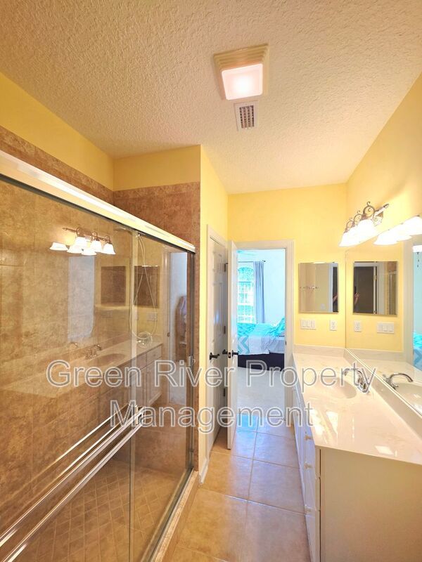 Spacious 5BR/5BA Home with Screened Pool & Pond View in Eagle Harbor at Black Creek! property image