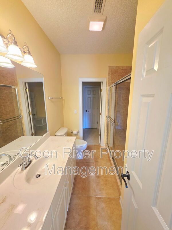 Spacious 5BR/5BA Home with Screened Pool & Pond View in Eagle Harbor at Black Creek! property image
