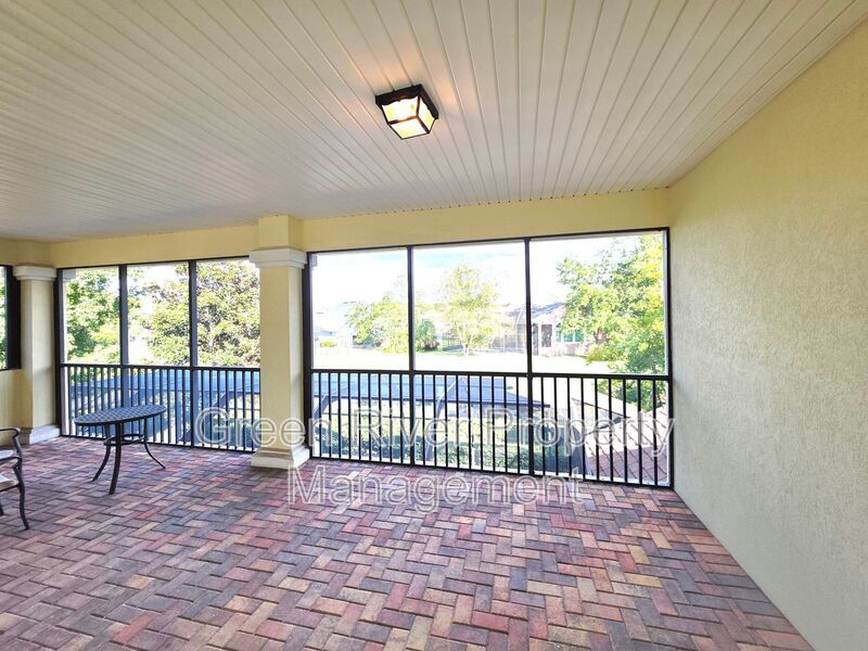Spacious 5BR/5BA Home with Screened Pool & Pond View in Eagle Harbor at Black Creek! property image