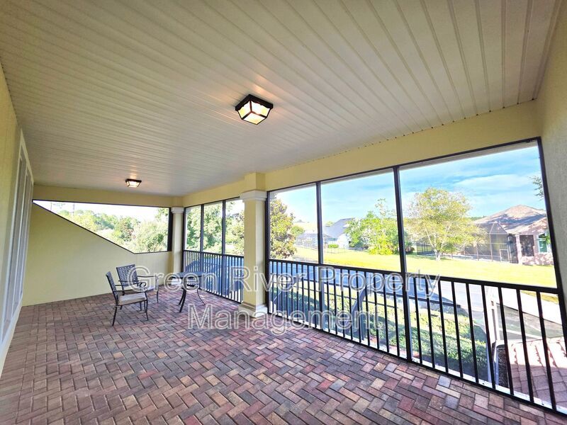 Spacious 5BR/5BA Home with Screened Pool & Pond View in Eagle Harbor at Black Creek! property image