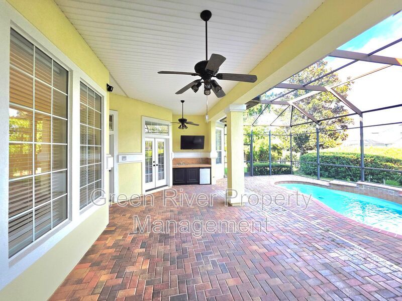 Spacious 5BR/5BA Home with Screened Pool & Pond View in Eagle Harbor at Black Creek! property image