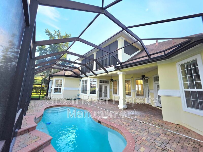 Spacious 5BR/5BA Home with Screened Pool & Pond View in Eagle Harbor at Black Creek! property image