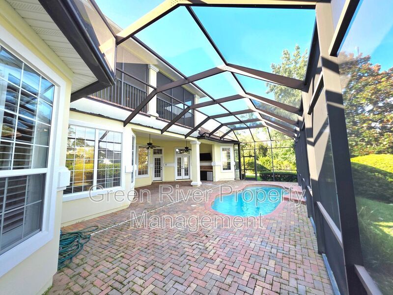 Spacious 5BR/5BA Home with Screened Pool & Pond View in Eagle Harbor at Black Creek! property image
