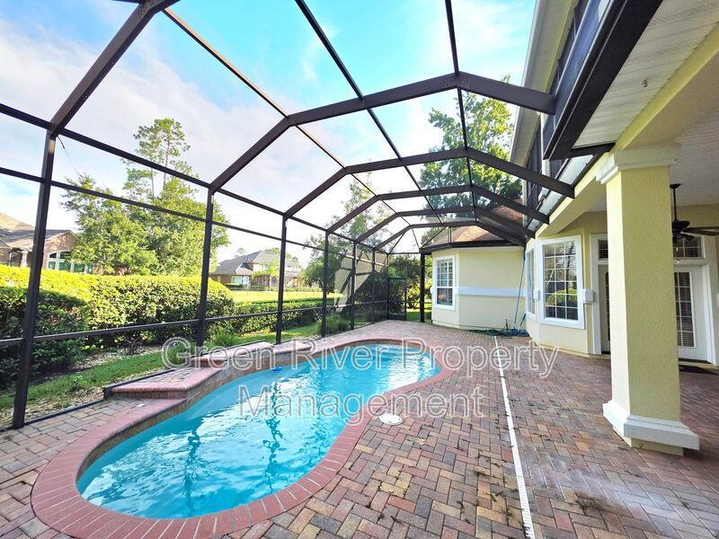 Spacious 5BR/5BA Home with Screened Pool & Pond View in Eagle Harbor at Black Creek! property image